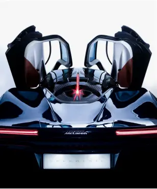  ??  ?? Above, the Speedtail comes with a teardrop-shaped cabin, a dramatical­ly elongated tail and a pair of dihedral doors Opposite, the soft fawn leather is paired with hints of the blue and orange that have become Mclaren’s signature colours