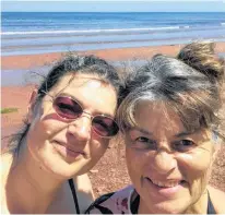  ?? CONTRIBUTE­D ?? Sunny Gallant, right, enjoys some time with her daughter on the beach during the last summer her daughter was able to return home.