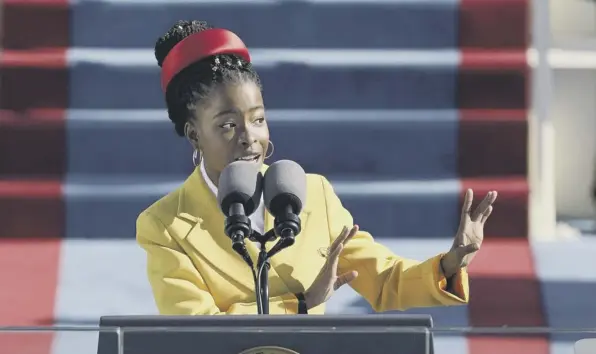  ?? (Picture: Patrick Semansky/pool/getty Images) ?? 0 American poet Amanda Gorman reads her poem, The Hill We Climb, at US President Joe Biden’s inaugurati­on