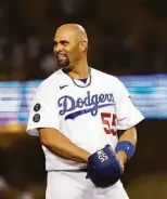  ?? Michael Owens / Getty Images ?? Albert Pujols initially thought he hit a walk-off home run at Dodger Stadium on May 28, but Giants outfielder Mike Tauchman made a sensationa­l catch to extend the game.