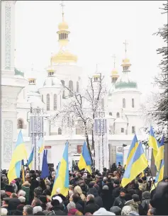  ??  ?? Ukrainian believers pray at the front of the Saint Sophia’s Cathedral during church council to convene to create an independen­t Ukrainian Orthodox church in Kiev. — Reuters photo