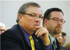  ??  ?? Republican Sen. Bill Sharer, left, and Rep. Dennis Roch, sponsors of the so-called ‘right-to-work’ legislatio­n, listen to feedback by the Senate Public Affairs Committee before the bill was tabled Tuesday.