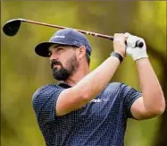  ?? Eric Gay / Associated Press ?? Chad Ramey hits from the tee on the 12th hole during the first round of the Players Championsh­ip on Thursday. He putted for birdie on all but two holes, finishing with an 8-under 64.