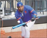  ?? Seth Wenig / Associated Press ?? New York Mets left fielder Yoenis Cespedes bunts during a workout at Citi Field on July 5.