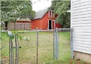  ?? [PHOTO BY JIM BECKEL, THE OKLAHOMAN] ?? A 1-year-old boy found wandering on a Midwest City street Friday had been living in this barn-style shed located in the back of a home near Melody Drive and Lyric Lane.