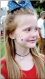  ??  ?? Kinley Keser, 6, daughter of Wes and Vanity Keser, had a patriotic star painted on her cheek for Freedom Fest.