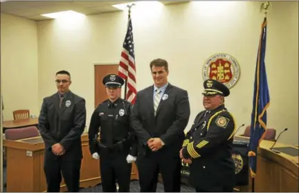  ?? BEN LAMBERT / HEARST CONNECTICU­T MEDIA ?? Winsted welcomed three new police officers Wednesday with a swearing-in ceremony. Above, from left, are Officer Joshua Blass, Officer Bryan Failla, Officer Justin Waltzer, and Police Chief William Fitzgerald Jr.