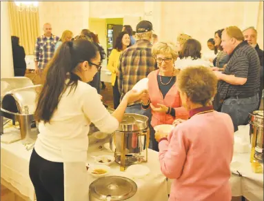  ?? Ben Lambert / Hearst Connecticu­t Media ?? The annual Empty Bowls fundraiser was held Thursday evening in the Elks Lodge on Litchfield Street, as local residents gathered together in fellowship to support the Community Kitchen of Torrington.