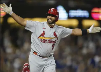  ?? AP PHOTO/ASHLEY LANDIS, FILE ?? St. Louis Cardinals designated hitter Albert Pujols (5) reacts after hitting his 700th home run during the fourth inning of a baseball game against the Los Angeles Dodgers in Los Angeles on Sept. 23, 2022.