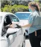  ?? ORLANDO SENTINEL ?? The once-a-week drive-thru meal pickup for anyone who works in the arts began at St. Luke’s United Methodist Churchon May 13.