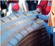  ??  ?? Medallions display the names of the USS Arizona’s crew members at a memorial unveiled on the University of Arizona campus in 2016. PATRICK BREEN/THE REPUBLIC