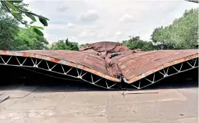  ??  ?? The nearly century-old Mississipp­i aircraft hangar being used as a bus depot by the TSRTC at Gowliguda collapsed on Thursday morning. One of the landmarks of the city, the hangar was lying in a state of neglect for last several years. —P.Surendra