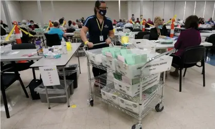  ??  ?? Election workers sort early ballots in October 2020, at the Maricopa county recorder’s office in Phoenix. Photograph: Matt York/AP