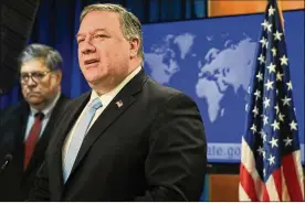  ?? YURI GRIPAS / POOL VIA AP ?? Secretary of State Mike Pompeo speaks as Attorney General William Barr listens, during a joint briefing Thursday on an executive order signed by President Donald Trump aimed at the Internatio­nal Criminal Court.