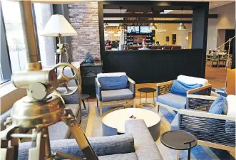  ??  ?? In keeping with the current trend in hotel restaurant­s to go casual with interior decor, Shoe and Canoe features an expansive 142-seat pub that oozes comfort and is far from a stuffy dining room.