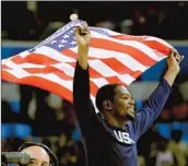  ?? Matt York Associated Press ?? KEVIN DURANT celebrates after the United States won the gold in men’s basketball in the Rio de Janeiro Olympic Games in 2016 by defeating Serbia, 96-66.