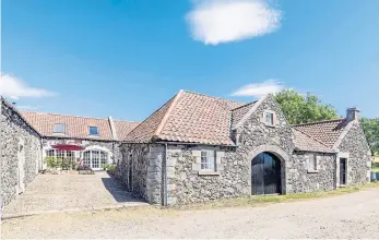  ?? ?? COUNTRY LIFE: Easter Newburn Steading, which has a beautiful outlook over farmland and the sea, has been tastefully extended over the years to create a bright, spacious home. The property lends itself to many uses and has potential for further developmen­t.