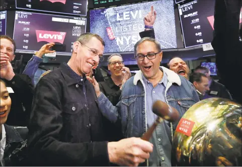  ?? Associated Press file photo ?? HP Chairman Chip Bergh, left, during a March initial public offering of stock for Levi Strauss, where he is CEO.