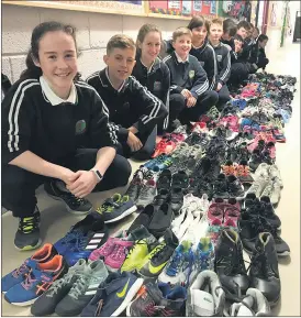  ?? ?? Children of Ransboro National School, Knocknahur, Co. Sligo, with their donations. Co-founder of In My Shoes, Ciaran McHugh attended Ransboro NS as a child.