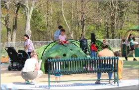  ?? ?? Community members of all ages enjoy playing at the Sam Pawlak Community Playground.