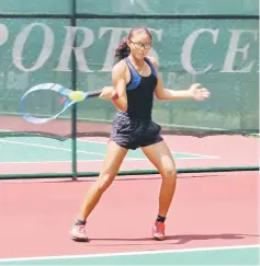  ??  ?? Malaysia’s Chloe Chong Zhi Jing hits a forehand return to Mio Kazaki of Japan in the singles qualifying at SLTA tennis centre yesterday. Chong lost 2-6, 1-6.