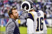  ?? FREDERICK BREEDON / GETTY IMAGES ?? Unlike Adam Gase, the Rams’ Sean McVay (left), the NFL’s youngest head coach, is making things happen with his quarterbac­k, Jared Goff.