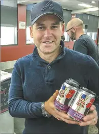  ??  ?? Channel 7’s national political reporter Alex Hart with some locally-brewed Dubbo Royale cans to take home. PHOTO: DUBBO