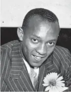  ?? FILE PHOTO ?? Jesse Owens, who won four gold medals in track and field in the 1936 Olympics in Berlin, is shown at Republican headquarte­rs. He lived in the Hilltop when Ohio State wouldn’t let him live on campus.