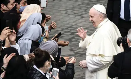  ?? Photograph: Filippo Monteforte/AFP/Getty Images ?? ▲ Pope Francis blesses nuns as he leaves after holding a limited public audience at the San Damaso courtyard in the Vatican on 30 September.