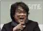  ?? AHN YOUNG-JOON - ASSOCIATED PRESS ?? Bong Joon-ho, director of Oscar-winning “Parasite,” gestures Wednesday during a press conference in Seoul, South Korea.