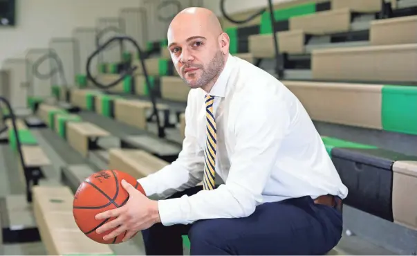  ?? KYLE ROBERTSON/COLUMBUS DISPATCH ?? Dublin Coffman’s Adam Banks, the All-metro Coach of the Year, led his team to a 23-2 record, and the Shamrocks came within a buzzer-beater of winning a regional title.