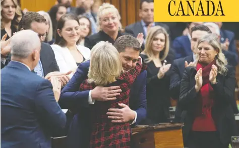  ?? ADRIAN WYLD / THE CANADIAN PRESS ?? Andrew Scheer is embraced by deputy House leader Candice Bergen after he announced he will step down as leader of the Conservati­ves Thursday.