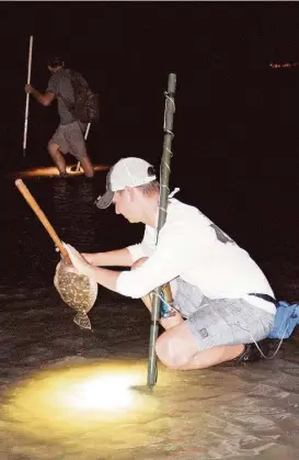  ?? Shannon Tompkins / Houston Chronicle ?? An evening spent gigging flounder in the shallows of a Texas bay is a traditiona­l, and often very productive, way anglers avoid the miserable heat and blazing sunlight of summer days.