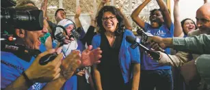  ?? NEW YORK TIMES FILE PHOTO ?? Rashida Tlaib celebrates Aug. 8 after winning the Democratic primary in Michigan’s 13th District at her campaign headquarte­rs in Detroit. A record number of women emerged from primary elections this year, powered by strong turnout among female voters and an apparent hunger across the electorate for candidates promising change.