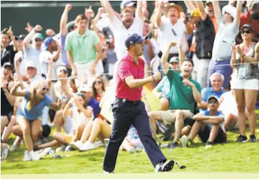  ?? Sam Greenwood / Getty Images ?? Justin Thomas exults after his birdie putt on the 13th green during the final round of the 2017 PGA Championsh­ip at Quail Hollow Club in Charlotte, N.C. He shot a 3-under-par 68 for a two-stroke victory.