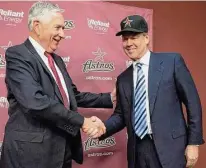 ?? David J. Phillip/Associated Press ?? Then-Astros owner Drayton McLane, left, shakes hands in 2011 with Jim Crane after a news conference to announce a group led by Crane was purchasing the baseball team.