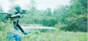  ?? (YouTube) ?? A SCREENSHOT of the video depicts teenagers holding paintball guns and running in a forest through a military-style obstacle course.