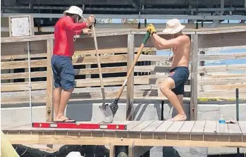  ?? ALICE HENLEY/COURTESY ?? Dania Beach closed its beach after Hurricane Irma hit on Sept. 10. It reopened on Wednesday, more than a week after the storm, partly thanks to lifeguards who pitched in to move trees and level out sand dunes created by the storm.