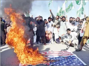  ?? ASIF HASSAN/AFP ?? Activists of the Difa-e-Pakistan Council shout anti-US slogans at a protest in Karachi yesterday.