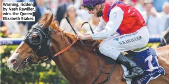  ?? ?? Warning, ridden by Nash Rawiller, wins the Queen Elizabeth Stakes.