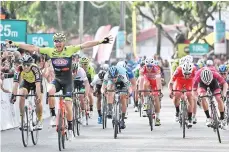  ?? — AFP photo ?? Neri Sottoli-Selle Italia-KTM's Simone Bevilacqua of Italy (front 2nd left) reacts as he crosses the finish line to win the seventh stage of the Le Tour de Langkawi from Pantai Cenang to Pantai Cenang in Langkawi April 12, 2019.