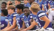  ??  ?? Jeremy Stewart / Rome News-Tribune
Model football players Kyler Eldridge (from left), Jabrious Smith, Jordon Wofford, Kirk McStotts (obscured) and Dawson Bradfield wait for the team picture to be taken Thursday at Model High School.