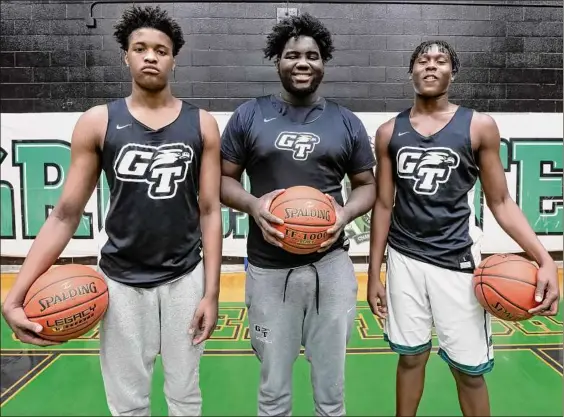  ?? Photos by Jim Franco / Times Union ?? Green Tech big men, from left, Olivan Owens, Henry Perkins and U’mier Graham have played a big role for the Eagles this season. As they have developed, opponents are facing more and more difficulty stopping their low-post game.