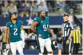  ?? MATT PATTERSON/AP ?? Eagles defensive tackle Fletcher Cox, right, and corner back Darius Slay look on during a Dec. 10 game in Dallas. Despite their disappoint­ment of a 1-6 slide to end the season, both vets demurred on questions about Nick Sirianni’s future.