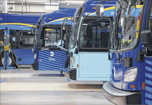  ?? Photos by Ari Lindquist / Bloomberg ?? New Flyer Industries Ltd. electric powered buses are manufactur­ed at a facility in St. Cloud, Minn. An agreement would test five New Flyer Industries Canada buses around the Capital Region within the next 12 to 18 months.