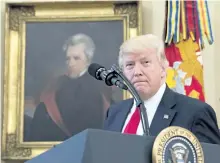  ?? THE ASSOCIATED PRESS FILES ?? A portrait of former president Andrew Jackson hangs on the wall behind U.S. President Donald Trump, at the White House in Washington. D.C. Trump made puzzling claims about Andrew Jackson and the Civil War in an interview.