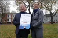  ?? MELISSA SCHUMAN - MEDIANEWS GROUP ?? Watervliet Mayor Michael Manning is presented with signs from DEC representa­tive Myra Fedyniak for the city’s achievemen­t as a “climate-smart community.”