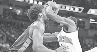  ?? DAN HAMILTON/USA TODAY SPORTS ?? Raptors forward Pascal Siakam elbows 76ers center Joel Embiid in the face as he drives to the basket in the final minutes of Game 6 of their first-round series at Scotiabank Arena.