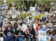  ?? MICHAEL DWYER — THE ASSOCIATED PRESS ?? People gather for a climate rally on Boston Common in Boston, Saturday. Organizers say they’re marking President Donald Trump’s first 100 days in office by protesting his agenda so far.