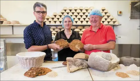  ??  ?? Dr Ben Gearey, Lecturer, Archaeolog­y, UCC; Dr Katharina Becker, Lecturer, Archaeolog­y, UCC and Declan Ryan of Arbutus Bread recreate Iron Age bread-making.